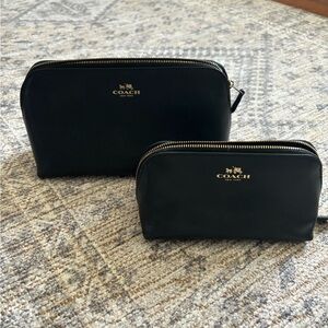 Coach black leather cosmetic pouches